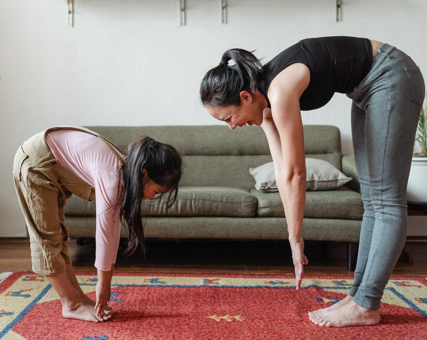 woman exercising with her daughter
