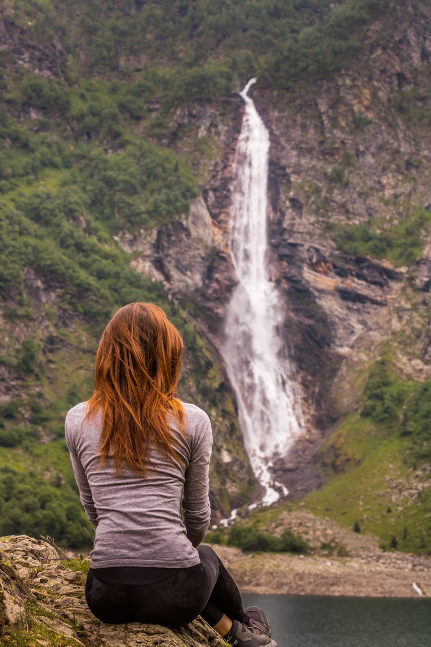 woman admiring cascade d ars waterfall france