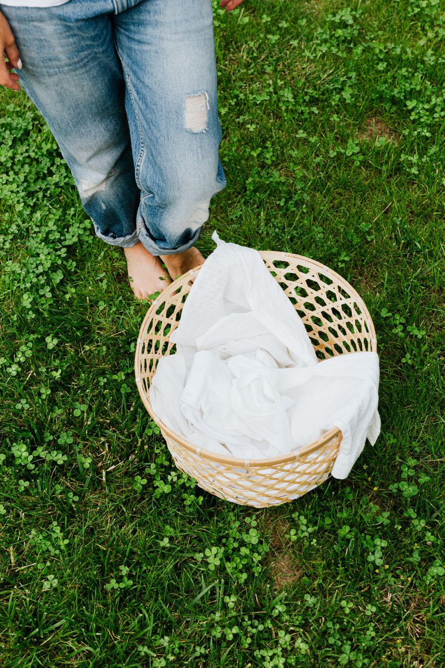 woman legs and loundry basket